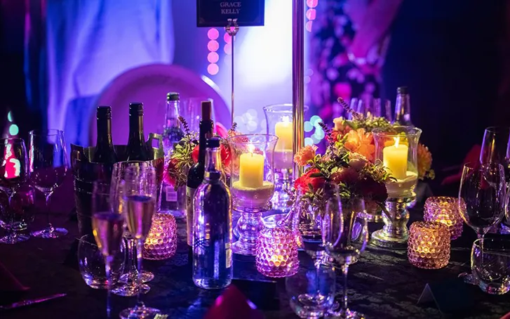 Table set with drinks and candles for dining party