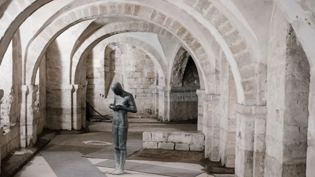 A Statue under an archway in Winchester