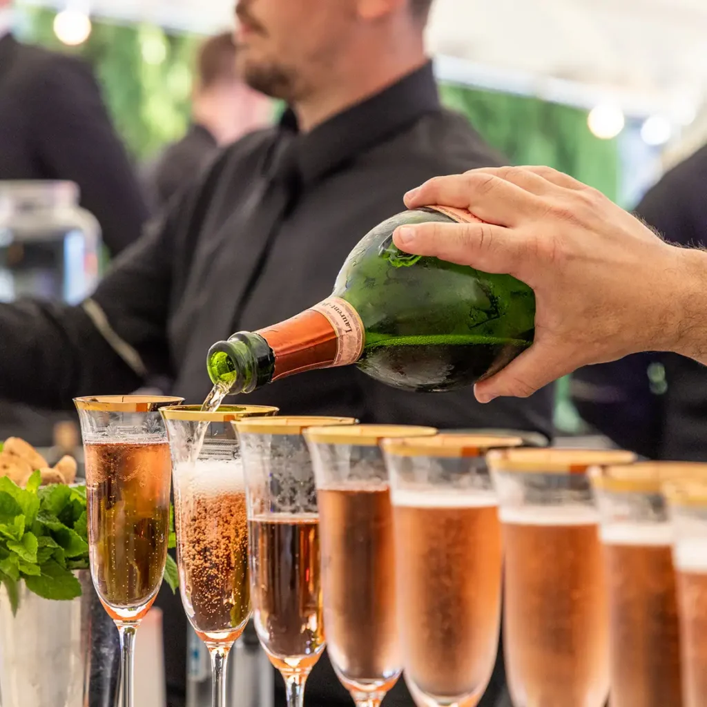 Champagne in gold rimmed flutes