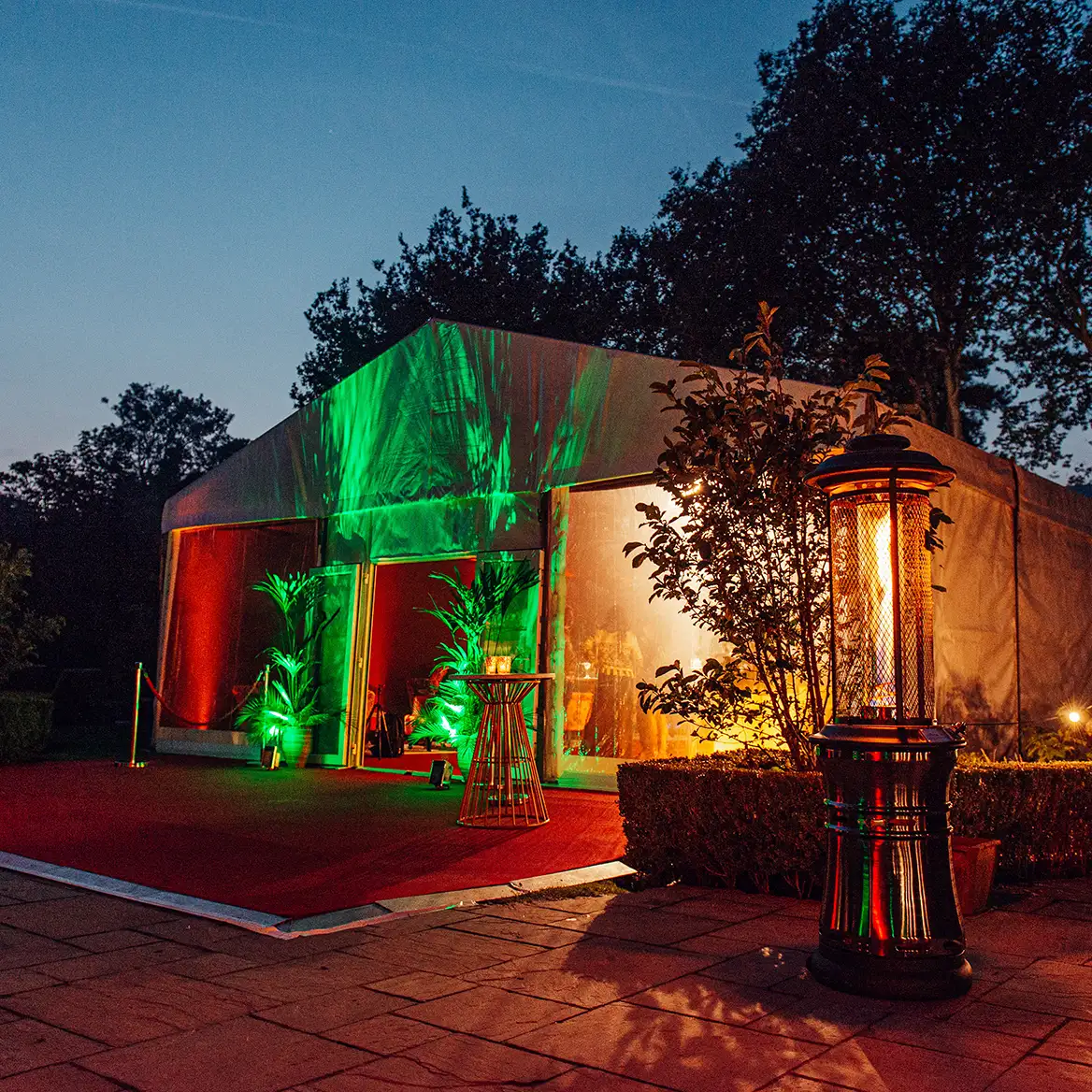 Evening light marquee lit up in green and ambient lighting