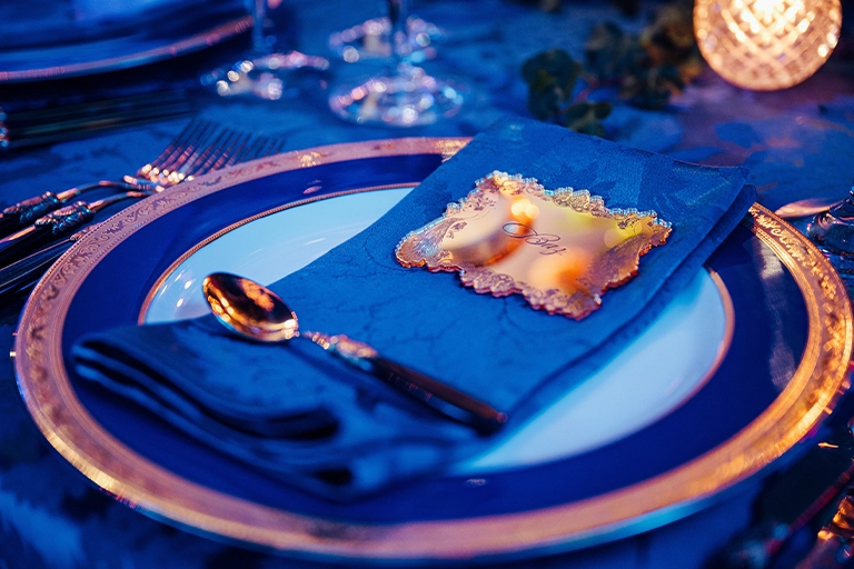 Personal table setting bespoke to themed event