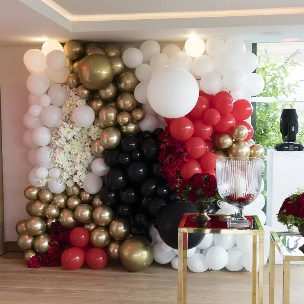 Red gold and black balloon wall