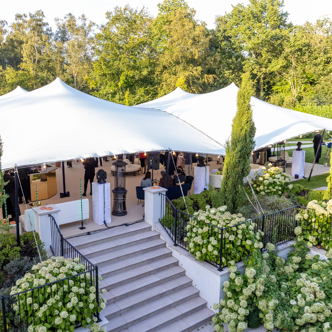 White luxury stretch tent with hydrangeas