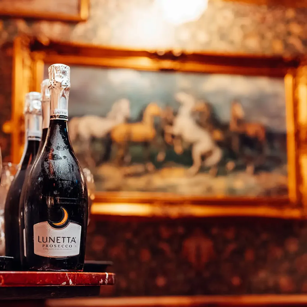 Champagne in room with gold-rimmed old fashion picture