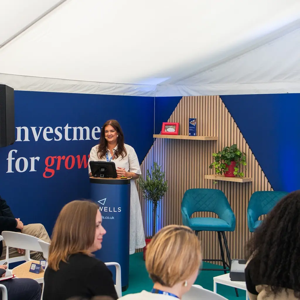 Woman presenting at exhibition stand