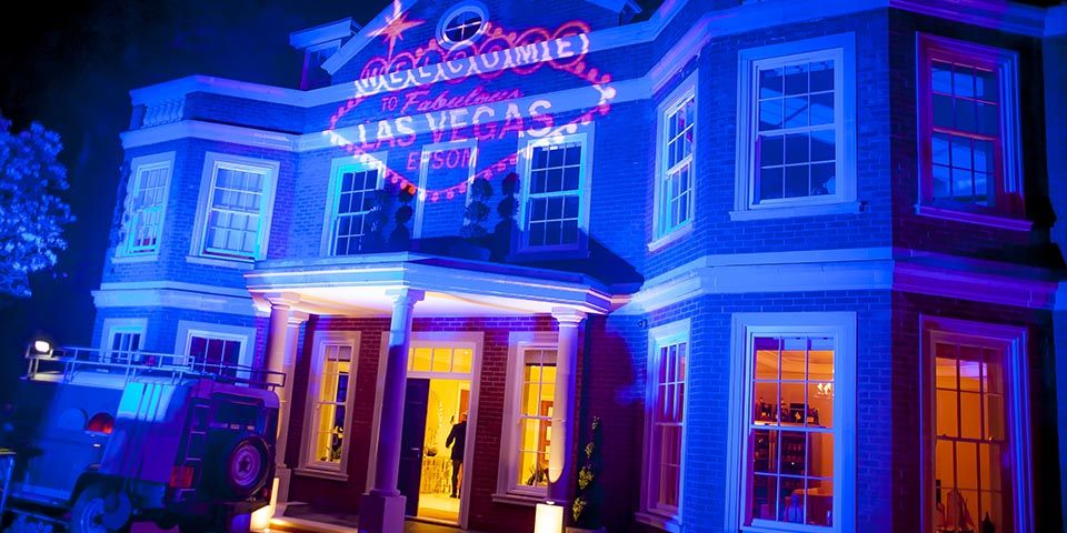 32 Party theme ideas perfect for your next celebration! 3 vegas sign projected onto front of our clients home