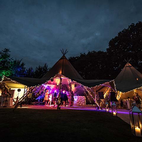 Tipi marquee with fairy lights at 50th Wedding anniversary in Surrey