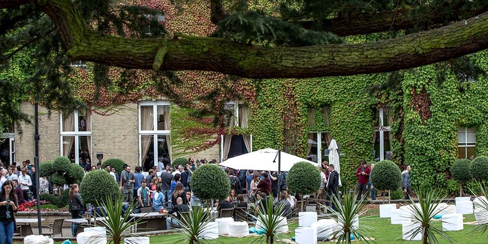 Event management corporate away day delegates in seated outdoor space