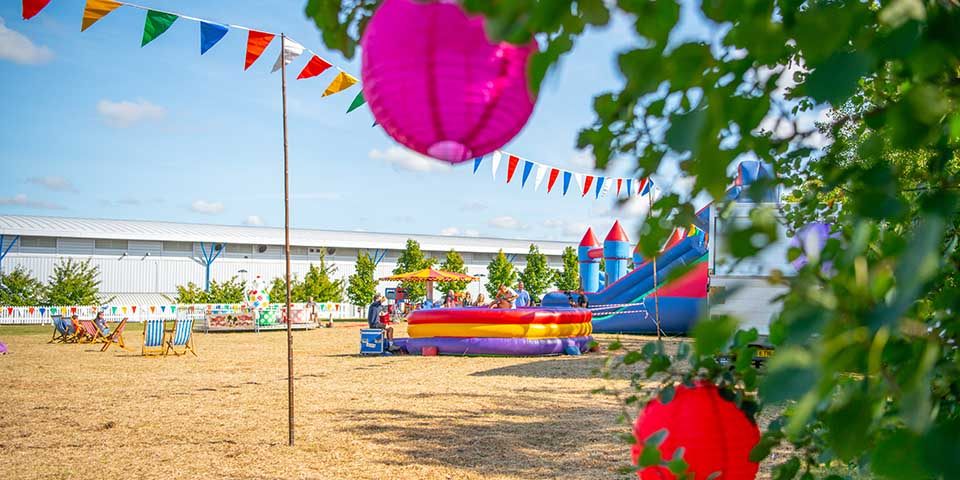 Bunting and lanterns at corporate fun day Corporate summer party themes