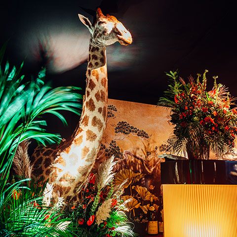 Life size giraffe at 50th birthday party luxury party