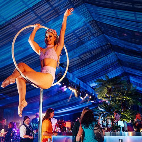 Acrobat dancer in luxury birthday party marquee
